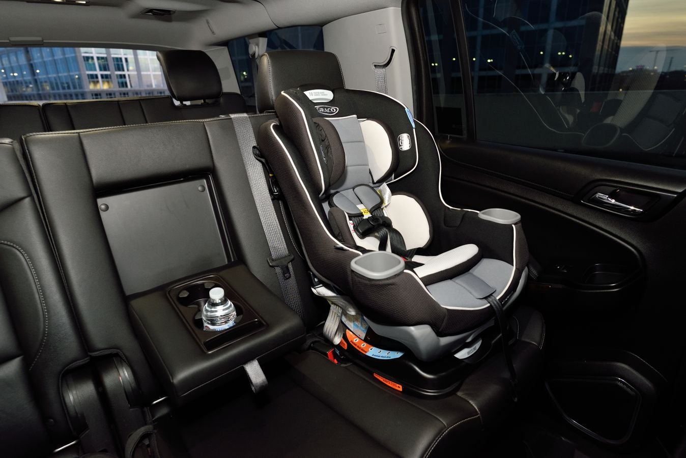 Empty child car seat installed in the back seat of a car