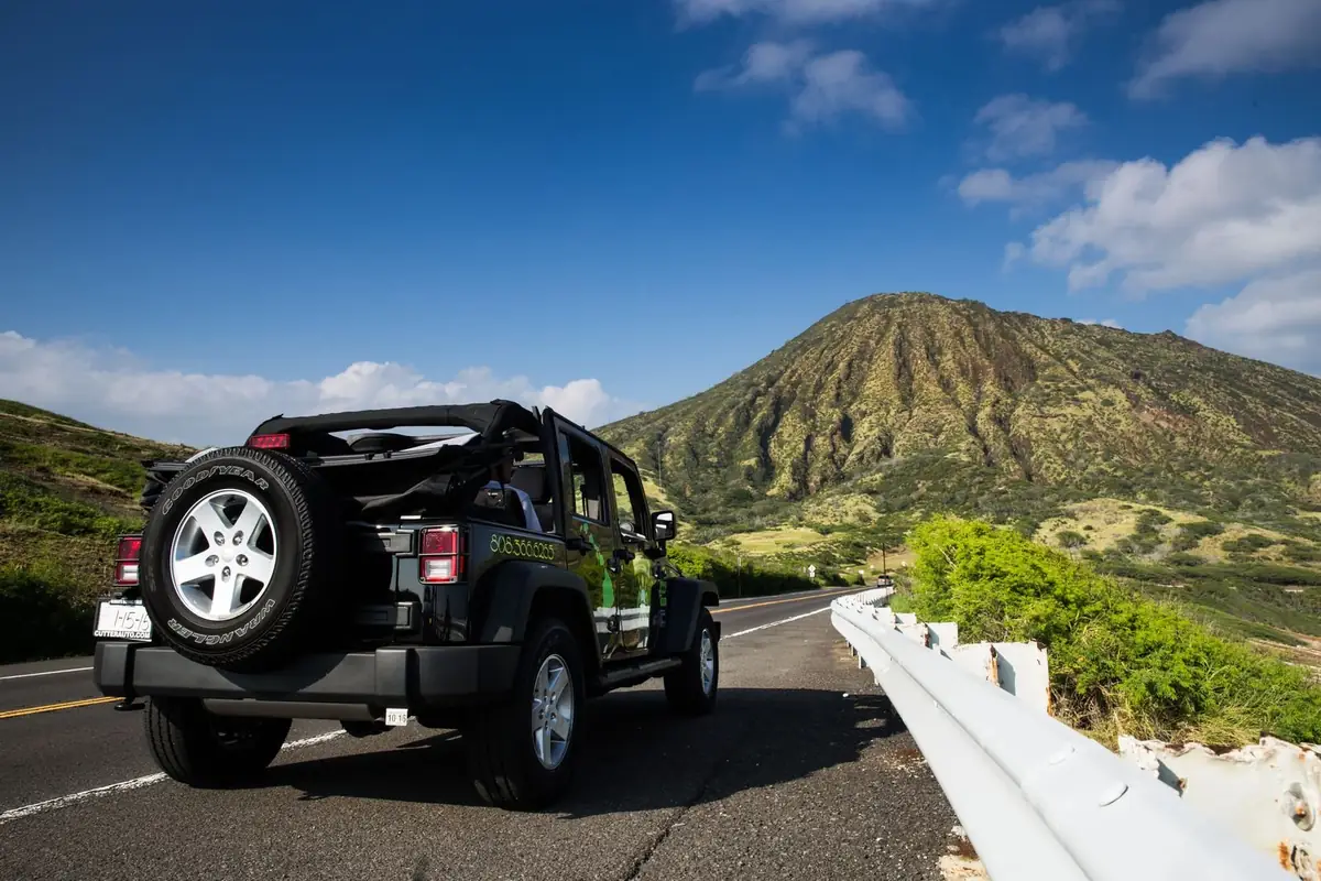 Jeep Wrangler rental on a scenic road