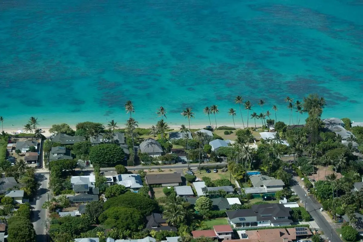 Aerial view of the Kailua coast on Oahu with turquoise water and beachfront homes