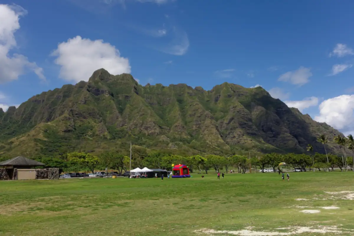 Kualoa Ridge rising behind the lawn at Kualoa Regional Park on Oahu